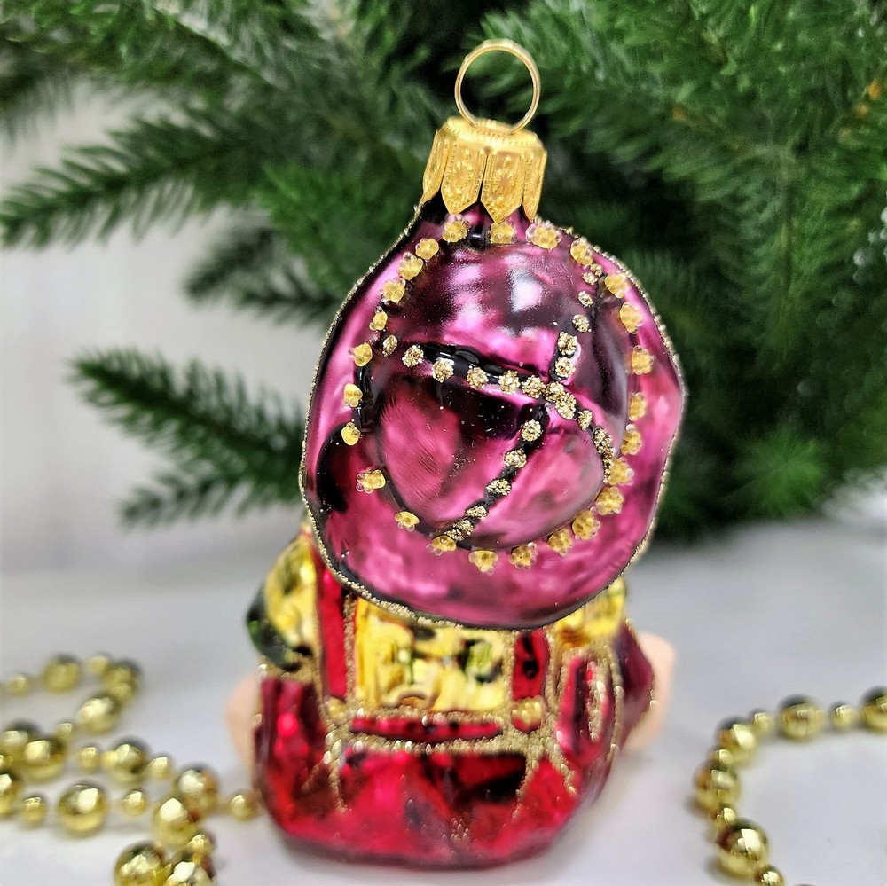 фото Стеклянная елочная игрушка Девочка с мишкой сидит