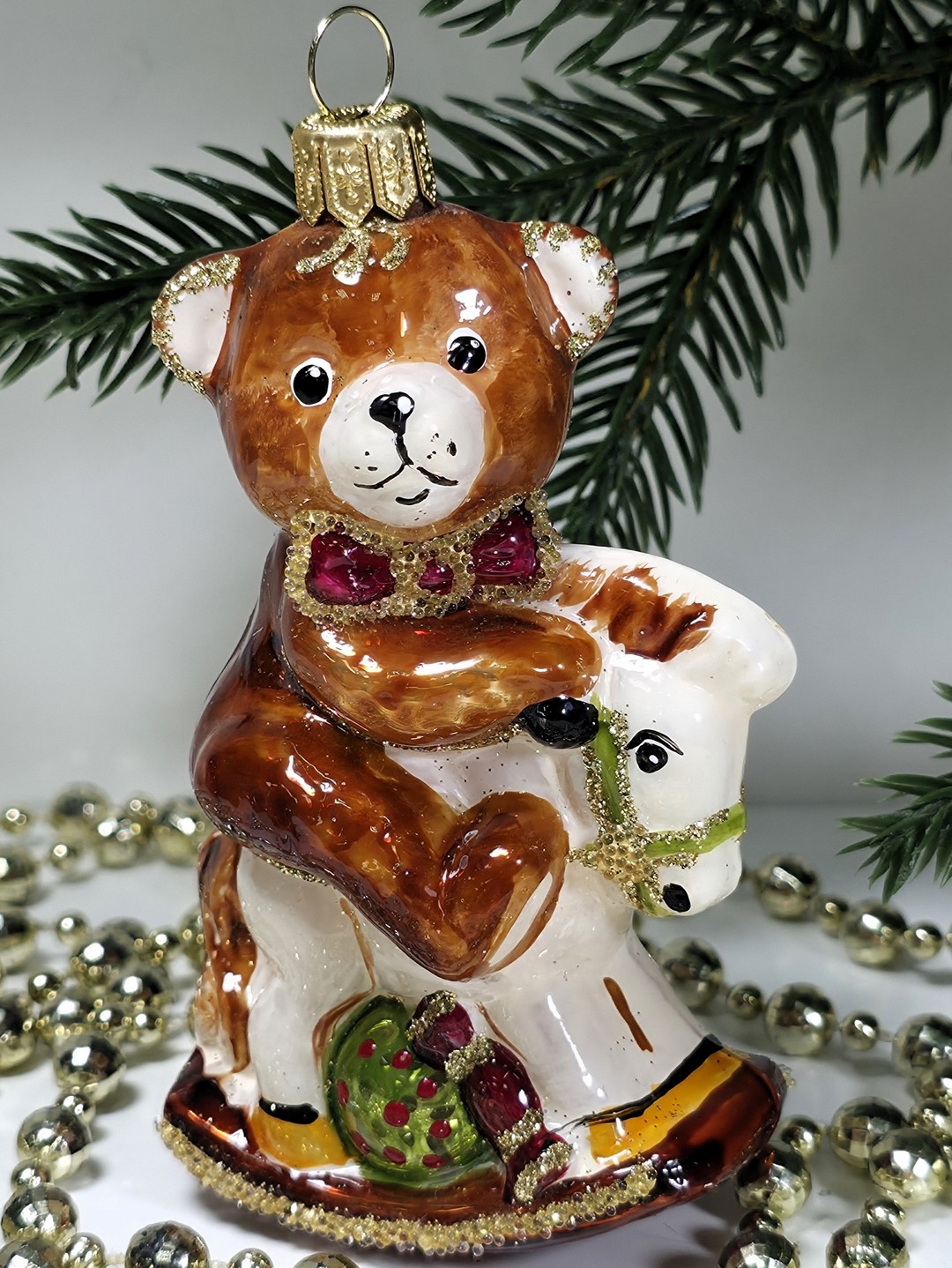 фото Стеклянная елочная игрушка Мишка на лошадке качалке