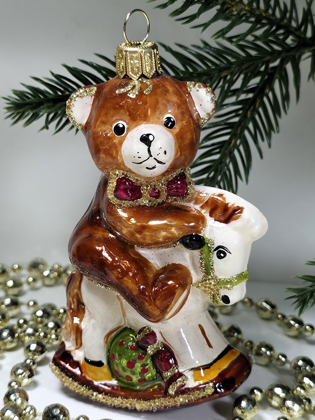 фото Стеклянная елочная игрушка Мишка на лошадке качалке