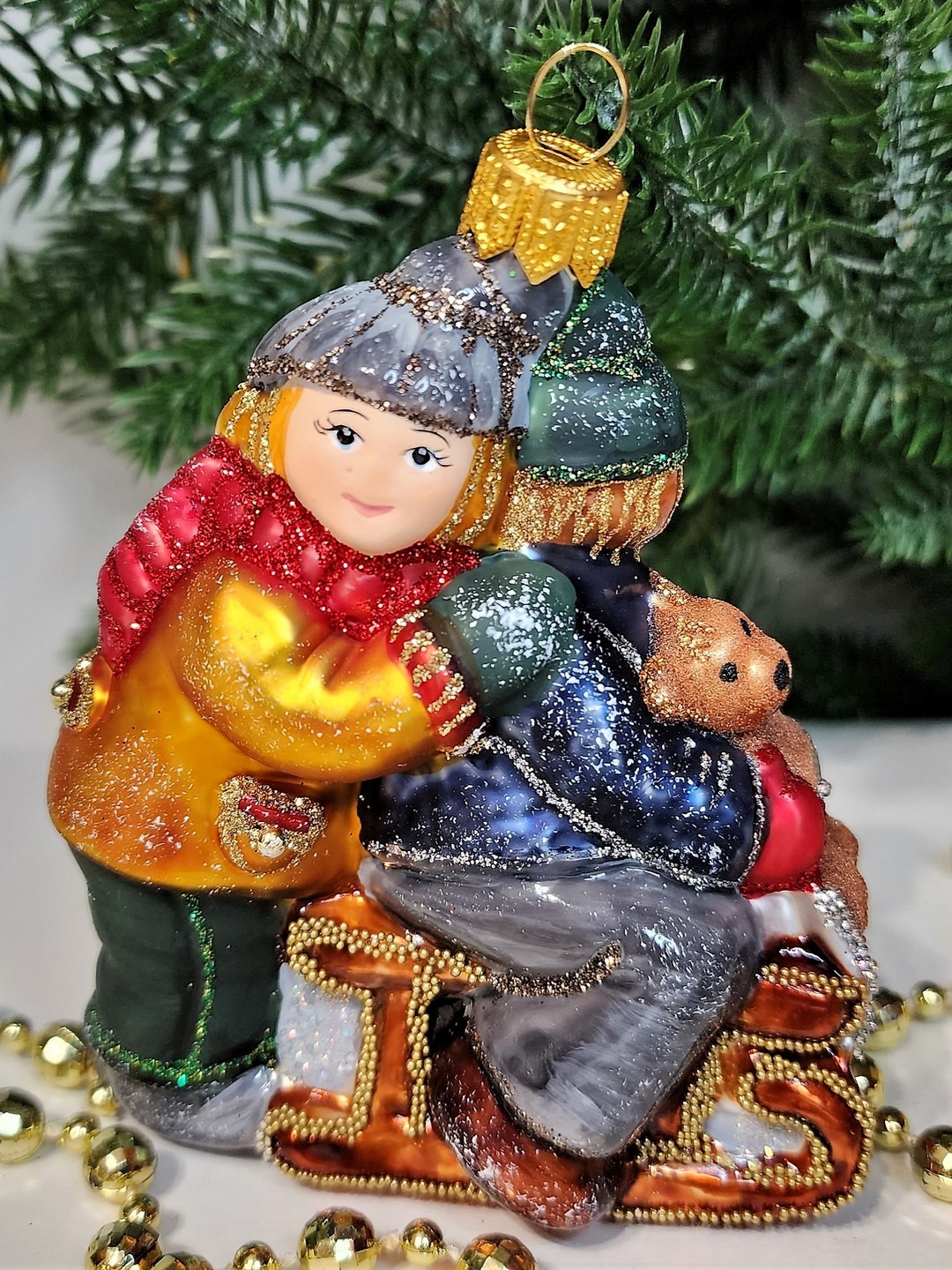 фото Стеклянная елочная игрушка Царские дети на санях