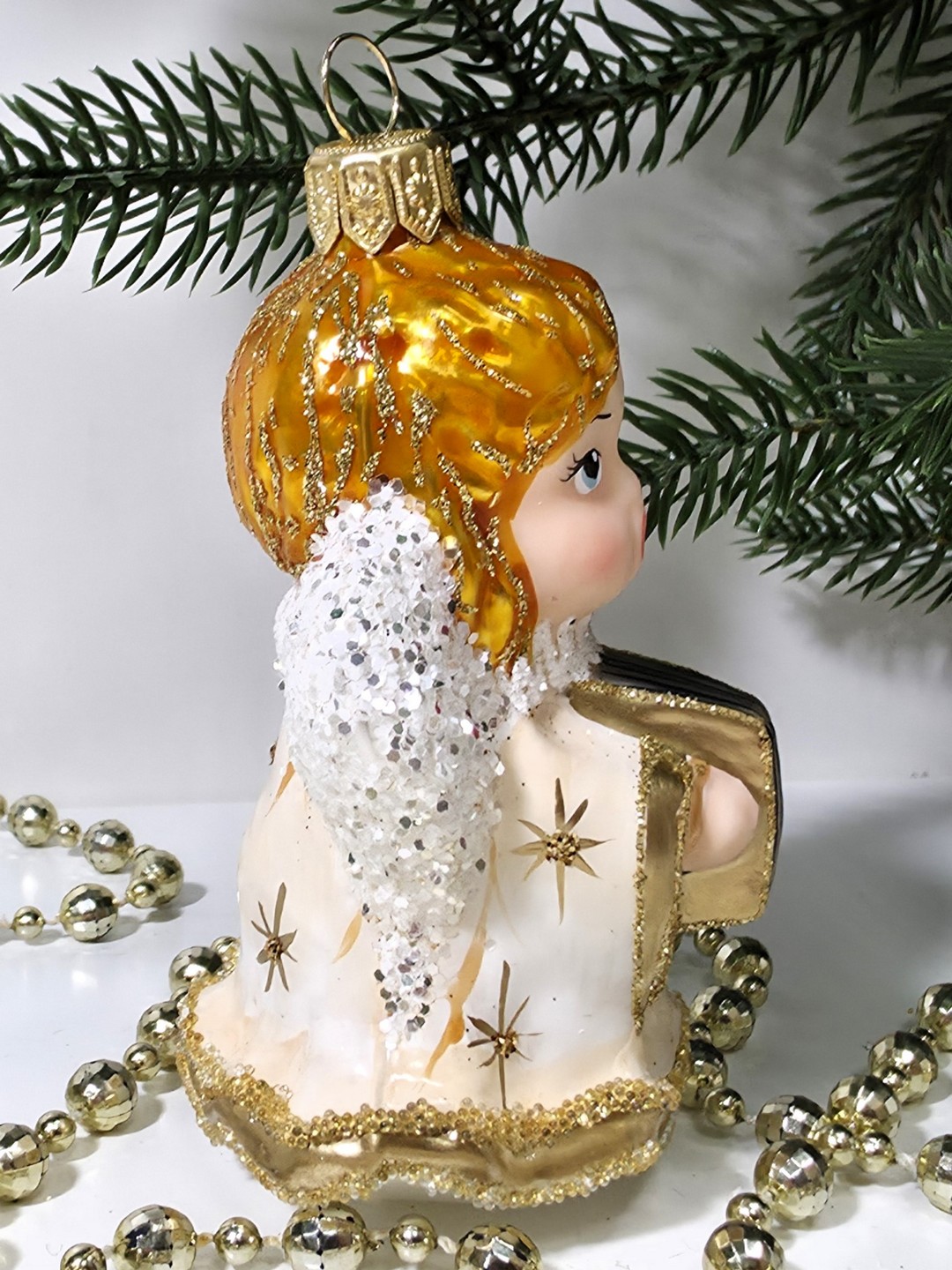 фото Стеклянная елочная игрушка Ангел с книгой