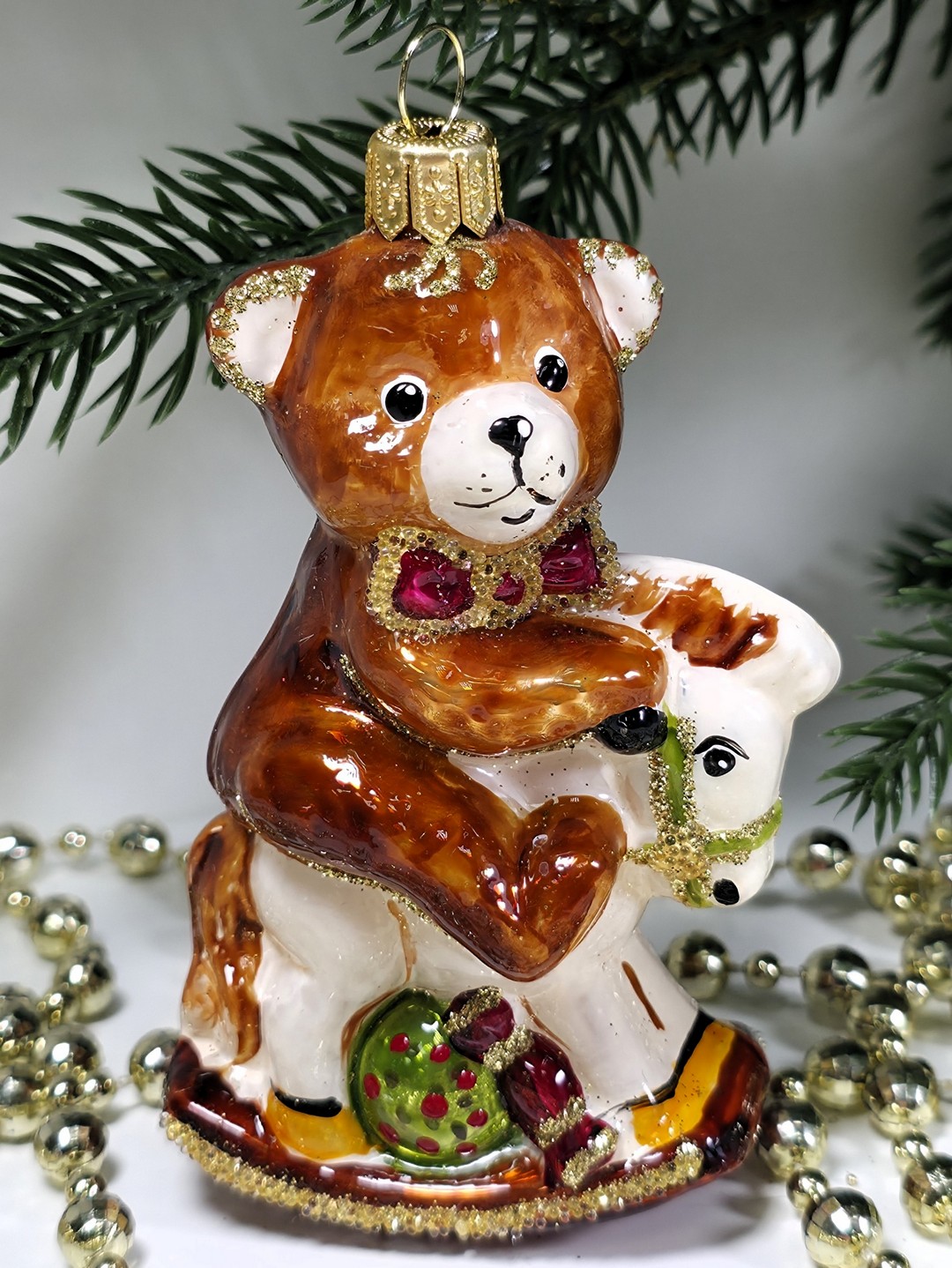 фото Стеклянная елочная игрушка Мишка на лошадке качалке