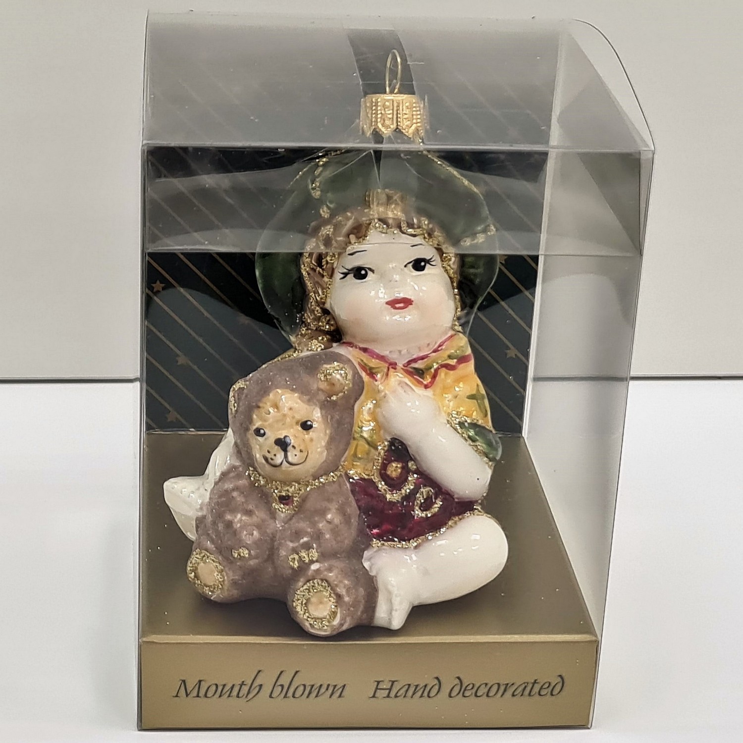 фото Стеклянная елочная игрушка Девочка с мишкой сидит