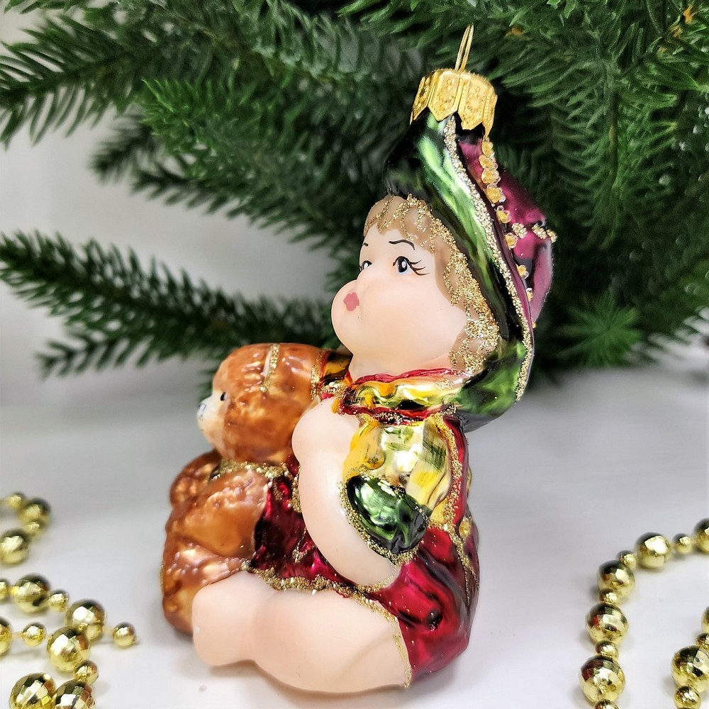 фото Стеклянная елочная игрушка Девочка с мишкой сидит