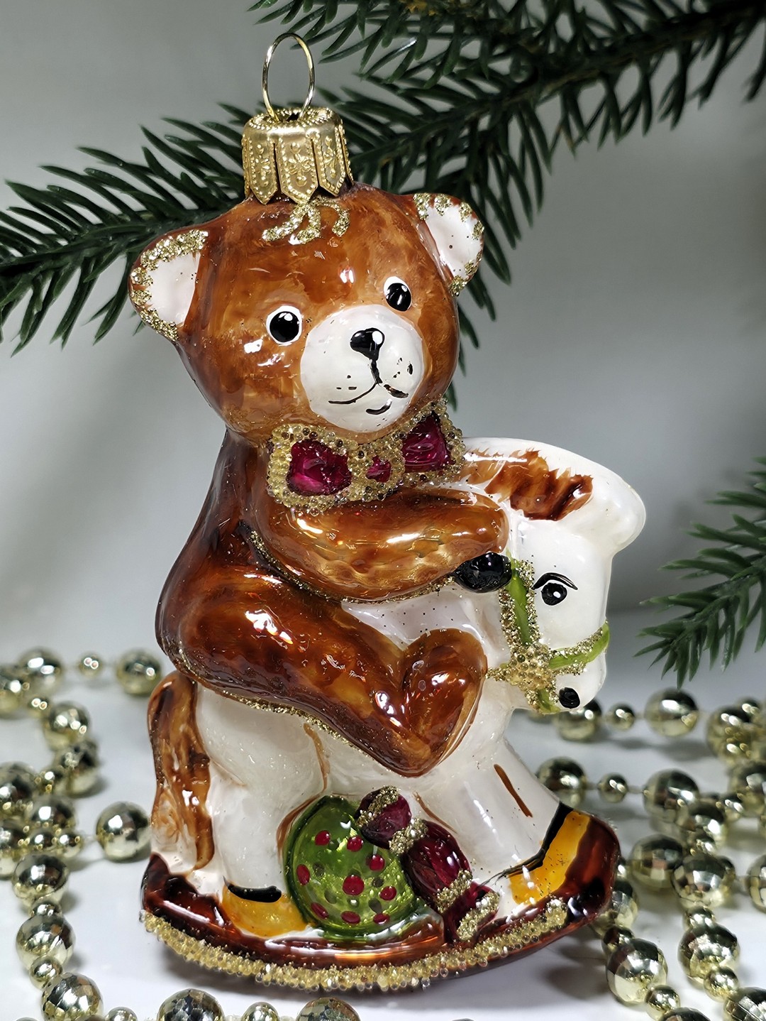 фото Стеклянная елочная игрушка Мишка на лошадке качалке