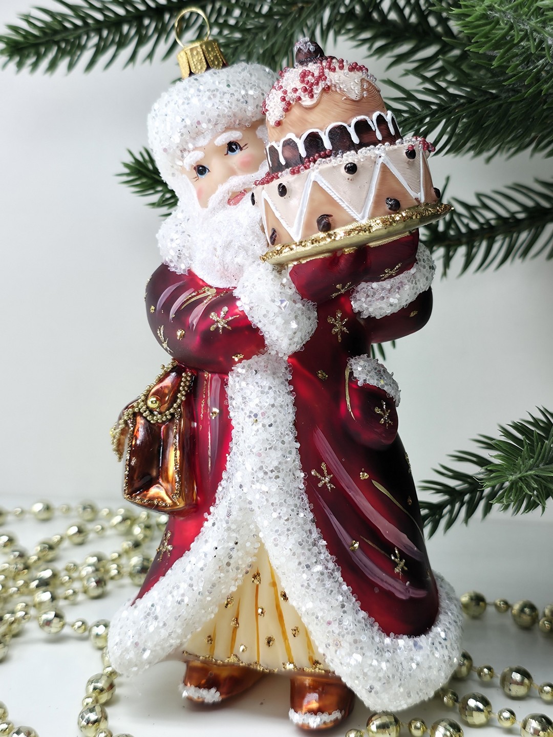 фото Стеклянная елочная игрушка Дед Мороз с тортом