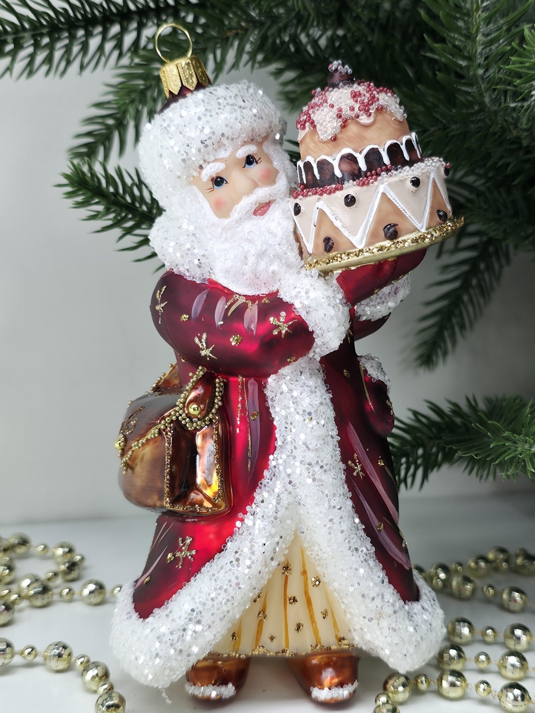 фото Стеклянная елочная игрушка Дед Мороз с тортом