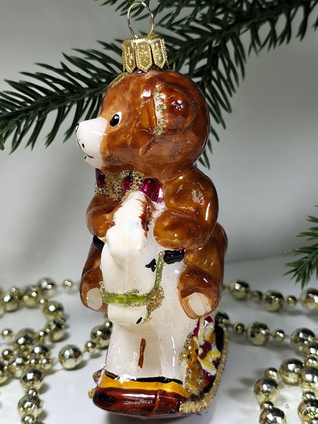 фото Стеклянная елочная игрушка Мишка на лошадке качалке