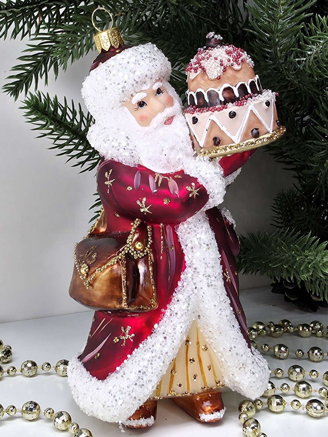 фото Стеклянная елочная игрушка Дед Мороз с тортом