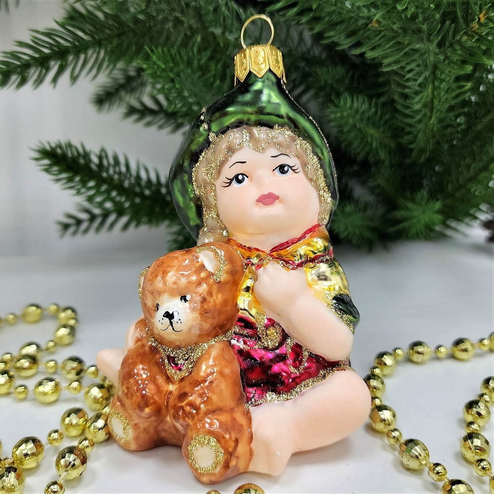 фото Стеклянная елочная игрушка Девочка с мишкой сидит