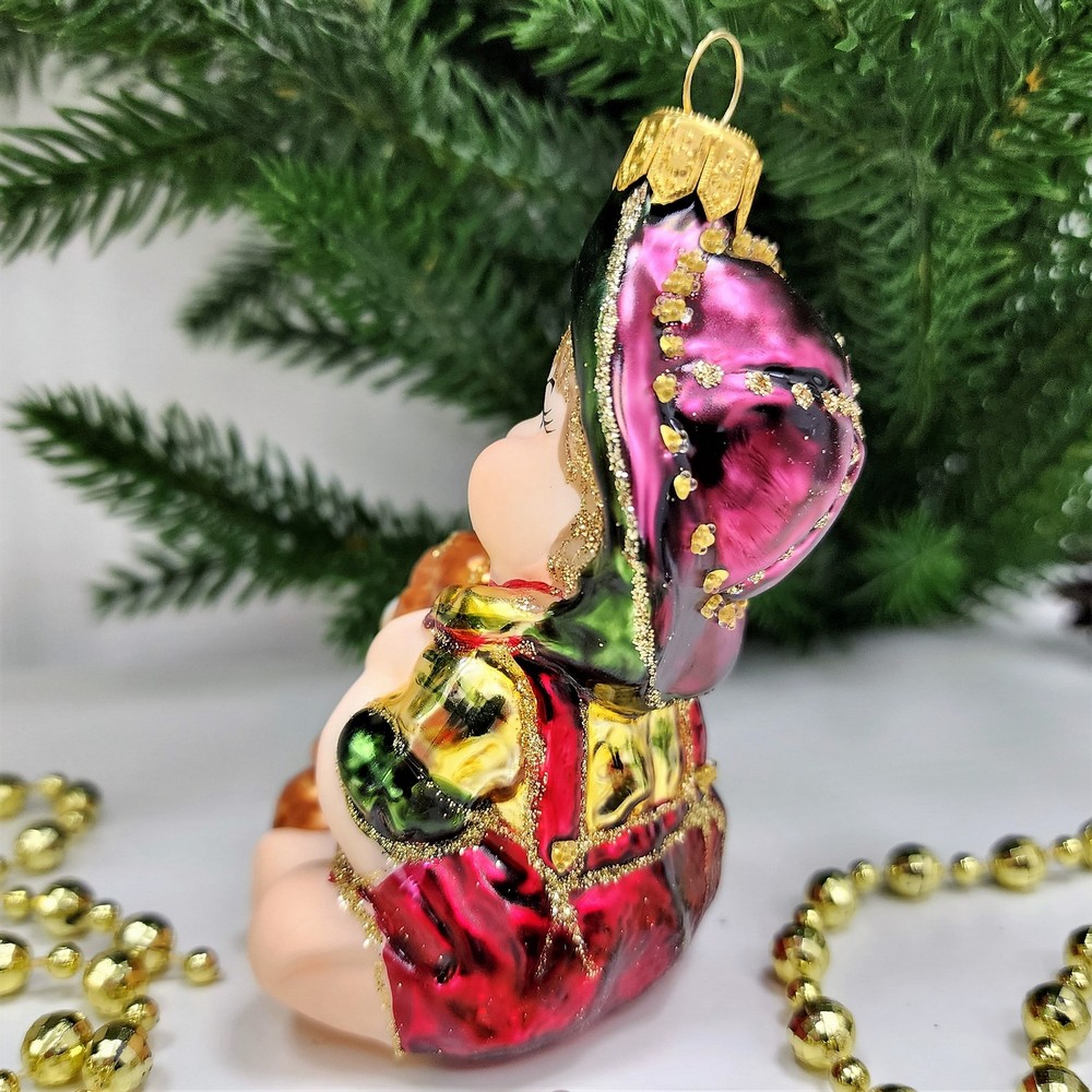 фото Стеклянная елочная игрушка Девочка с мишкой сидит