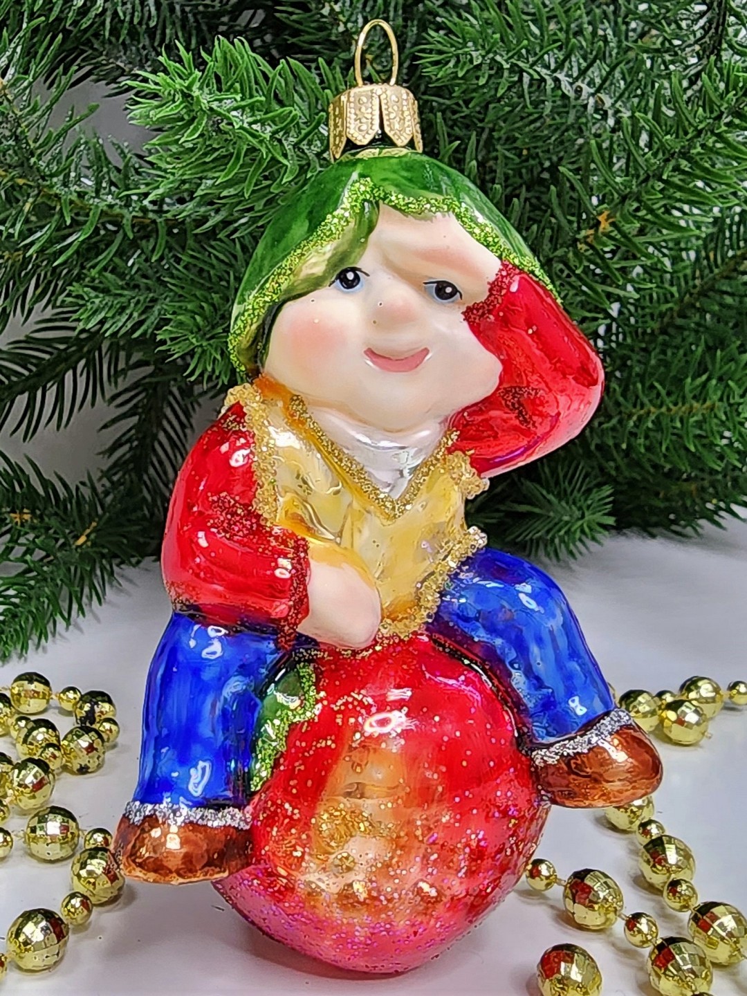 фото Стеклянная елочная игрушка Гном на яблоке