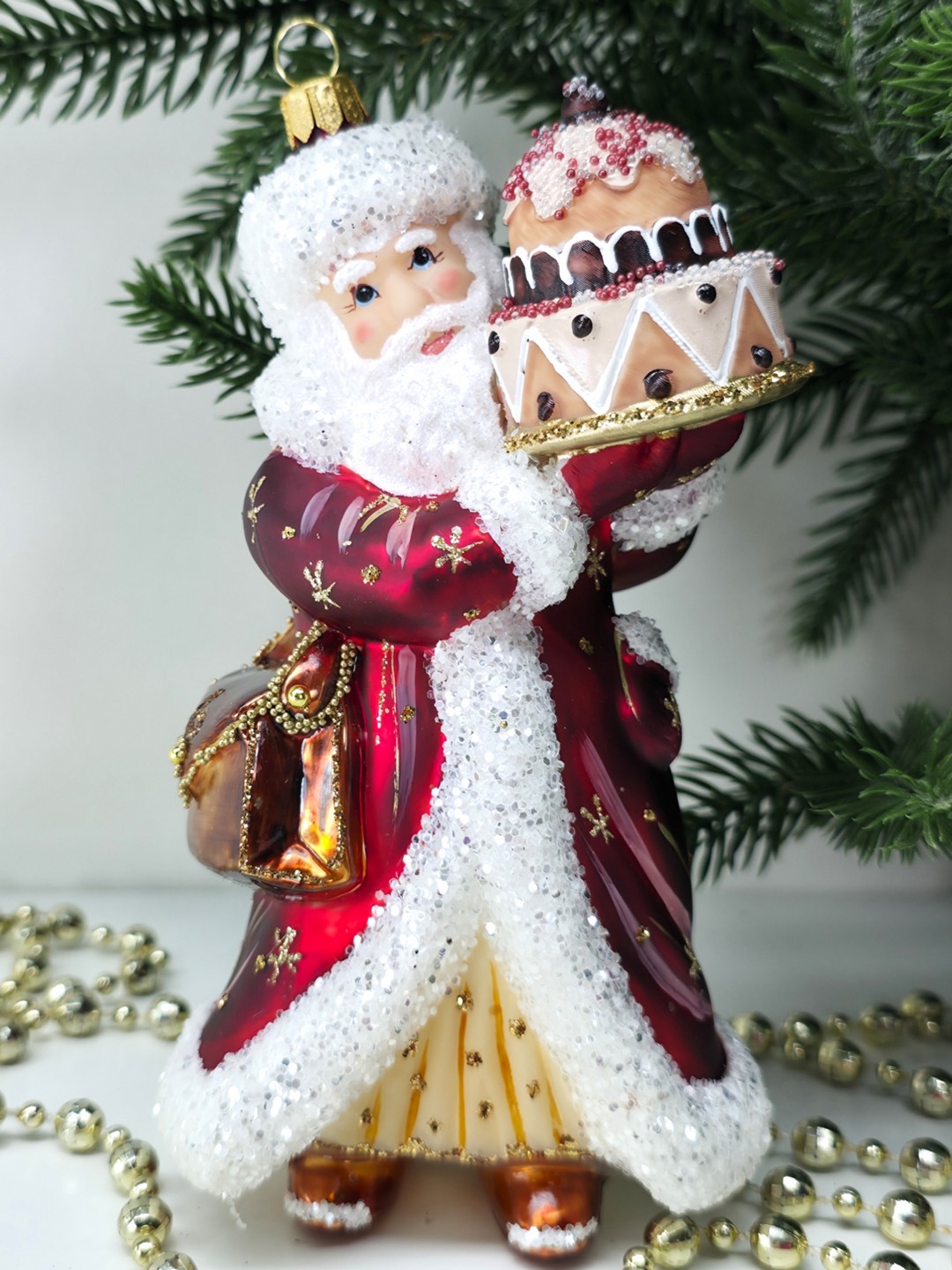 фото Стеклянная елочная игрушка Дед Мороз с тортом