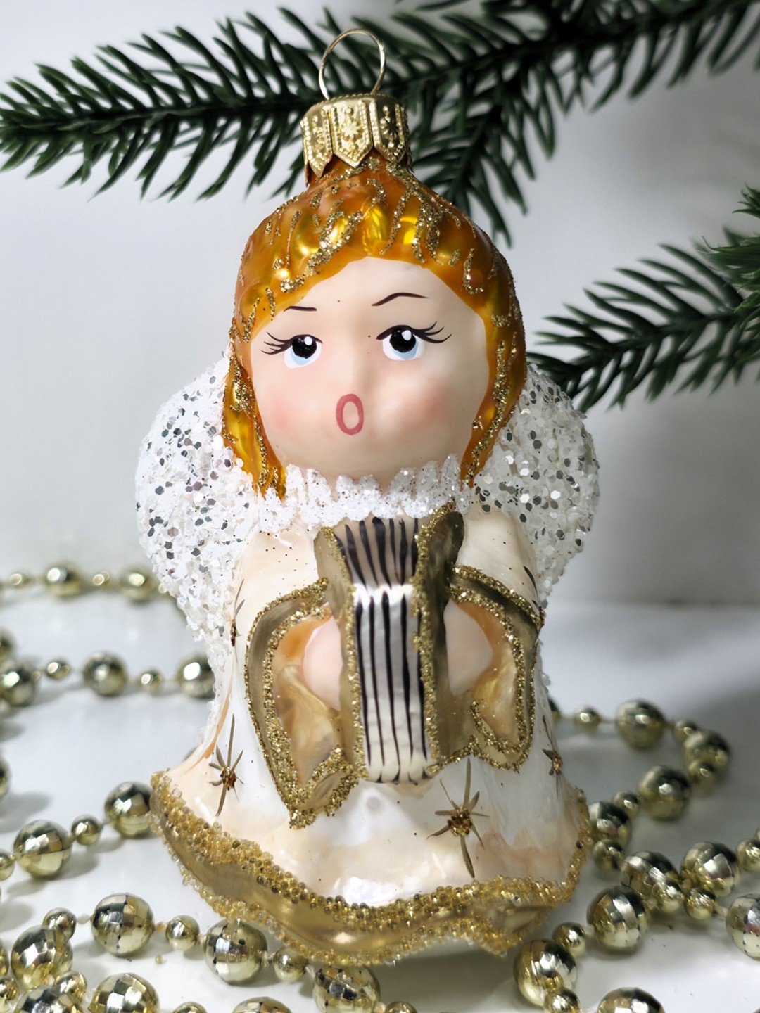 фото Стеклянная елочная игрушка Ангел с книгой