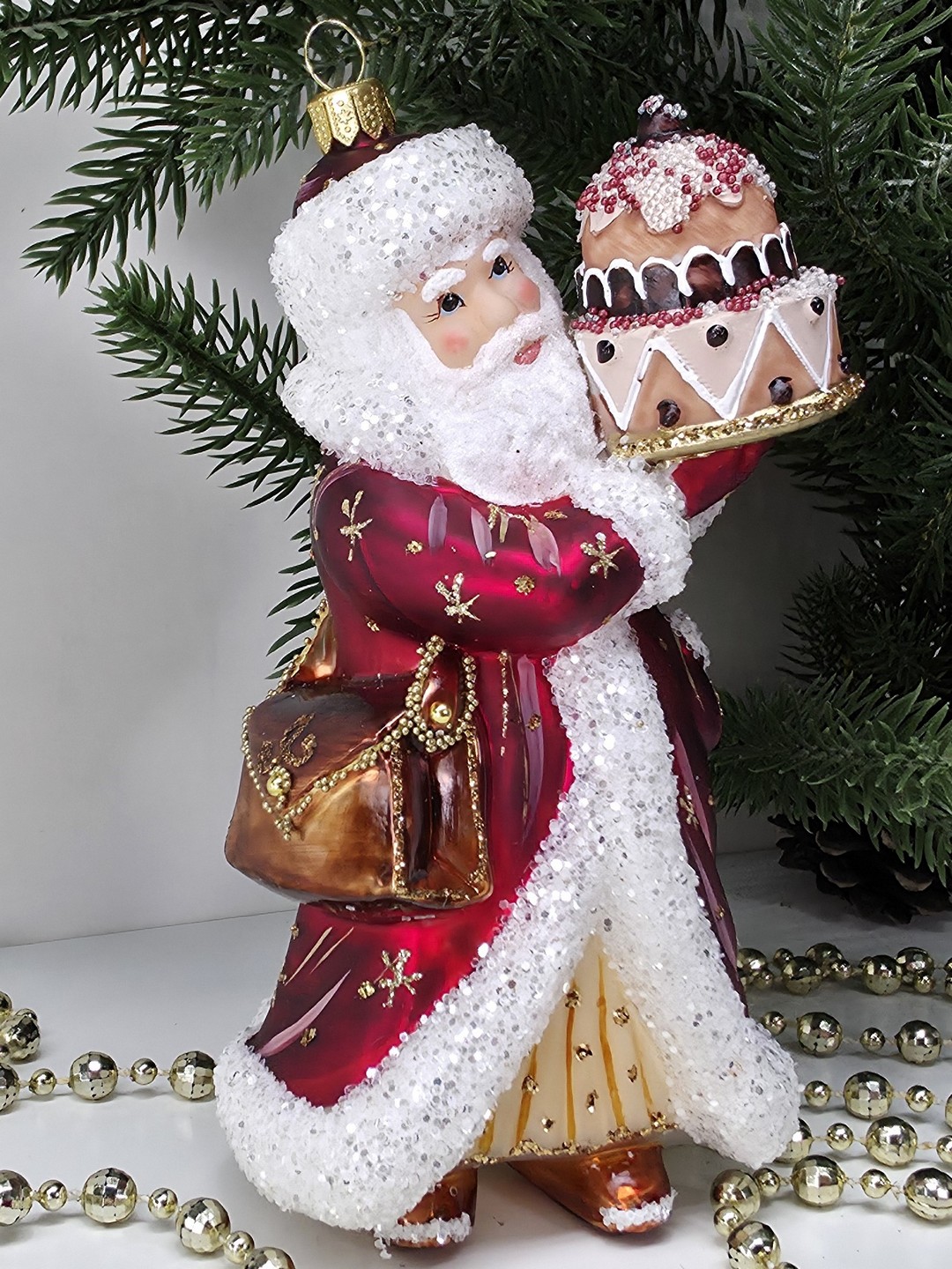 фото Стеклянная елочная игрушка Дед Мороз с тортом