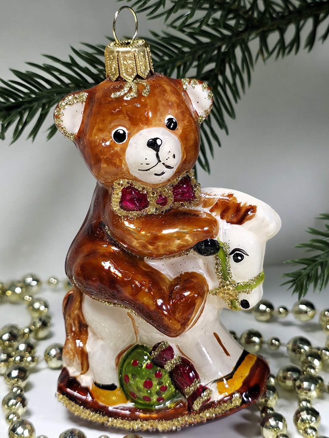 фото Стеклянная елочная игрушка Мишка на лошадке качалке