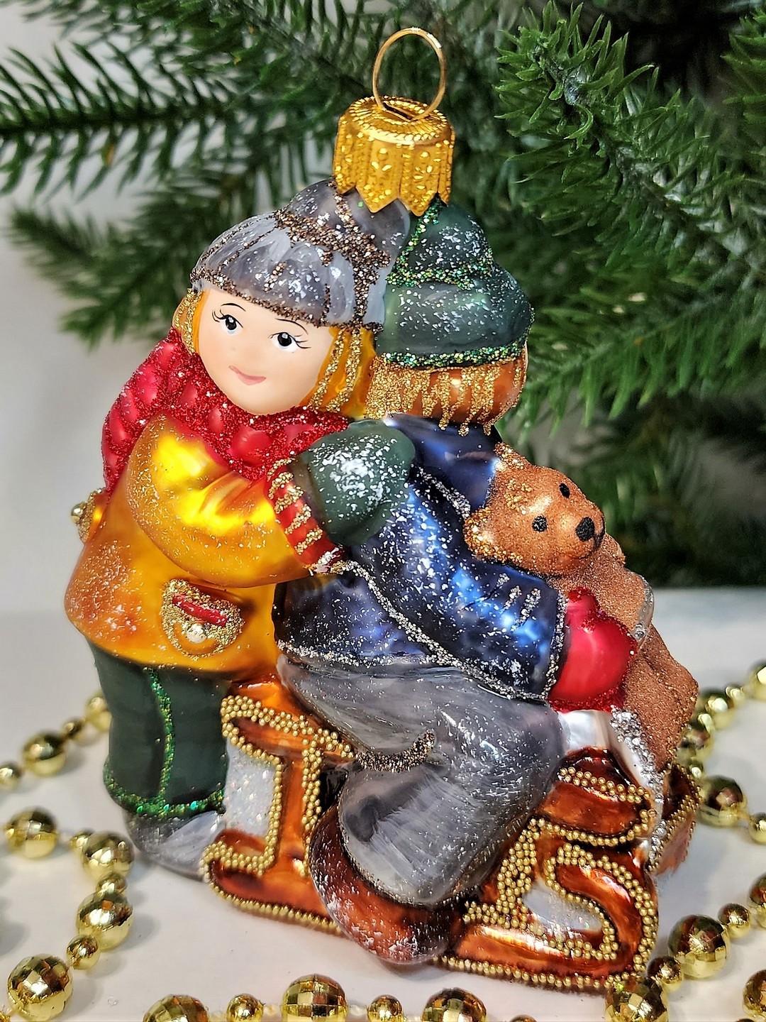 фото Стеклянная елочная игрушка Царские дети на санях