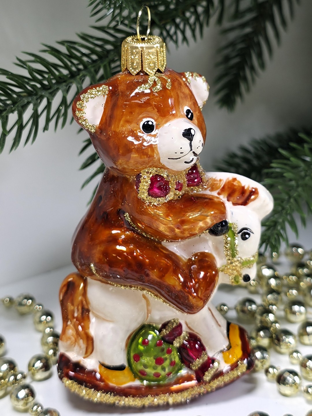 фото Стеклянная елочная игрушка Мишка на лошадке качалке