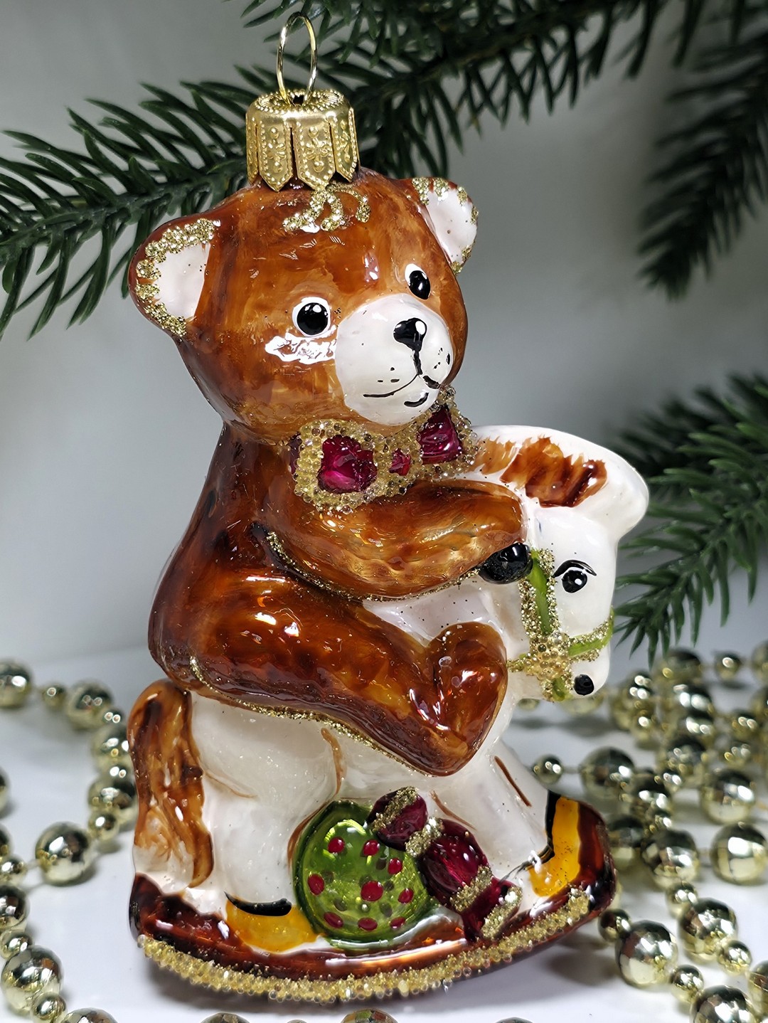 фото Стеклянная елочная игрушка Мишка на лошадке качалке