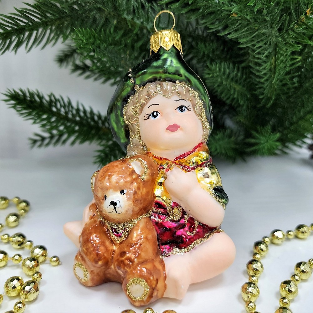 фото Стеклянная елочная игрушка Девочка с мишкой сидит