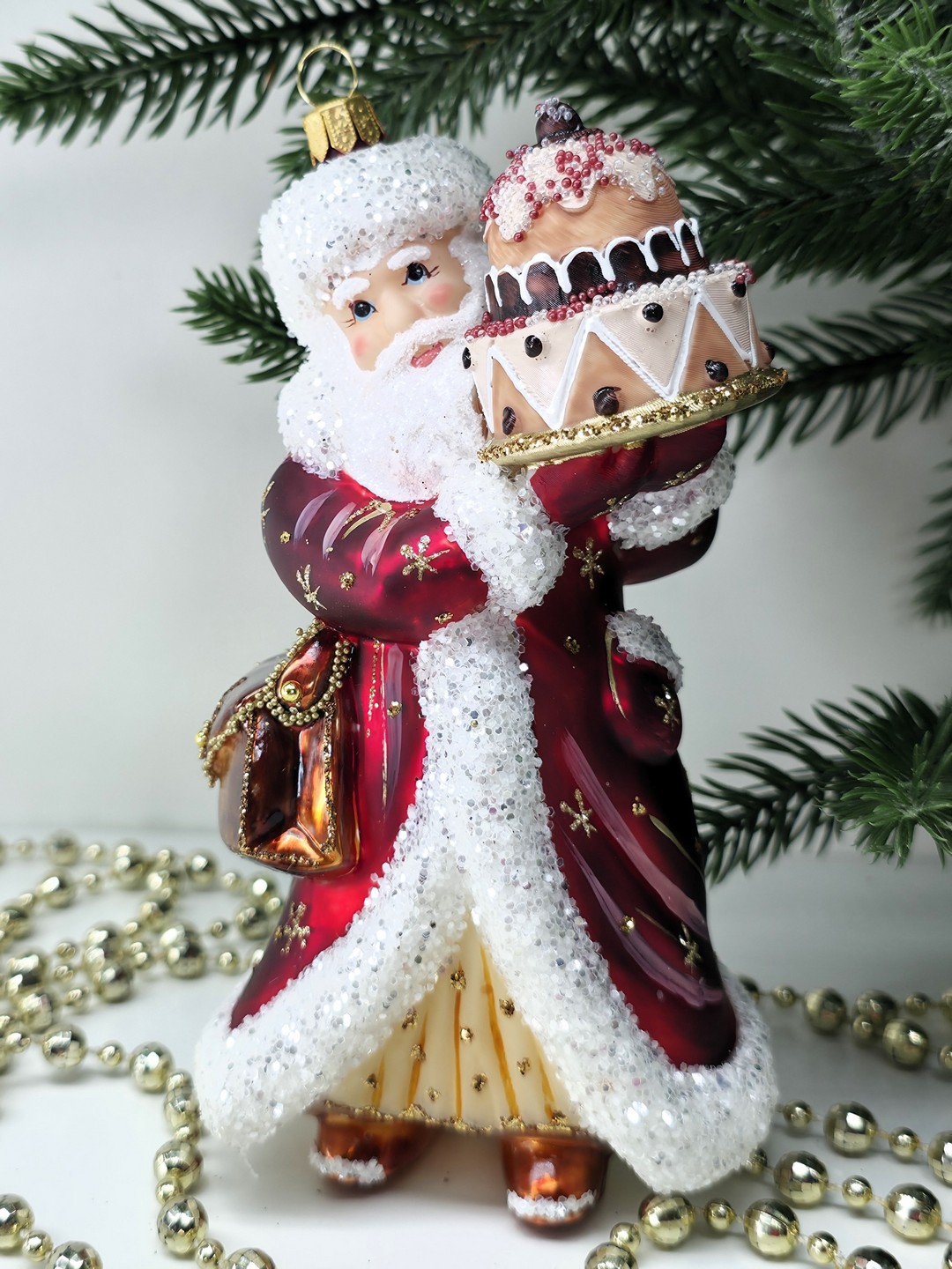 фото Стеклянная елочная игрушка Дед Мороз с тортом