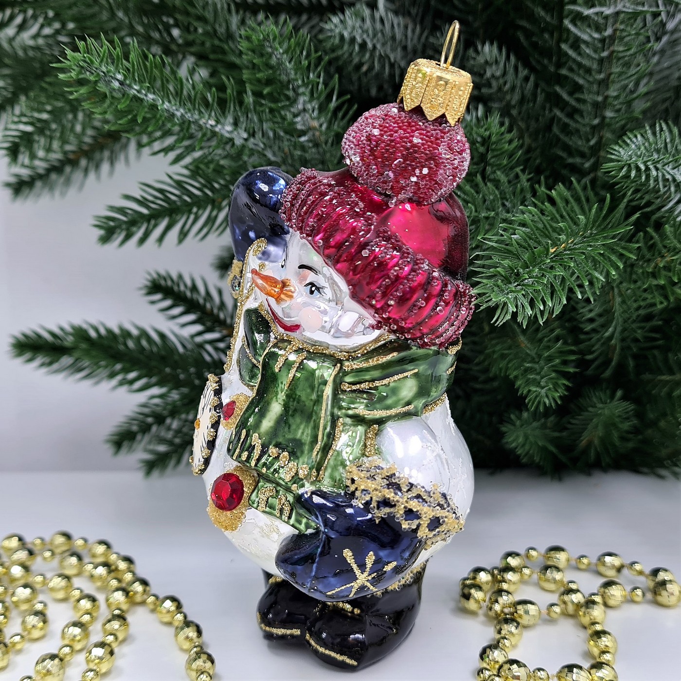 фото Стеклянная елочная игрушка Снеговик с часиками