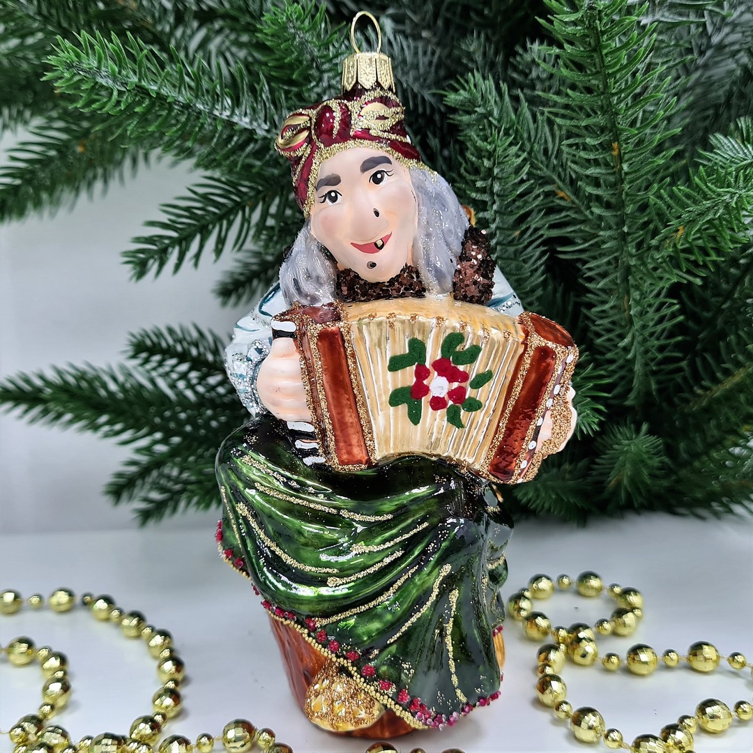 фото Стеклянная елочная игрушка Баба Яга с гармошкой