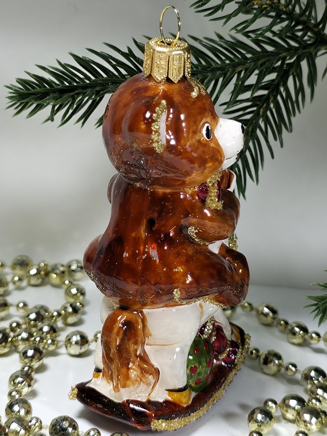 фото Стеклянная елочная игрушка Мишка на лошадке качалке