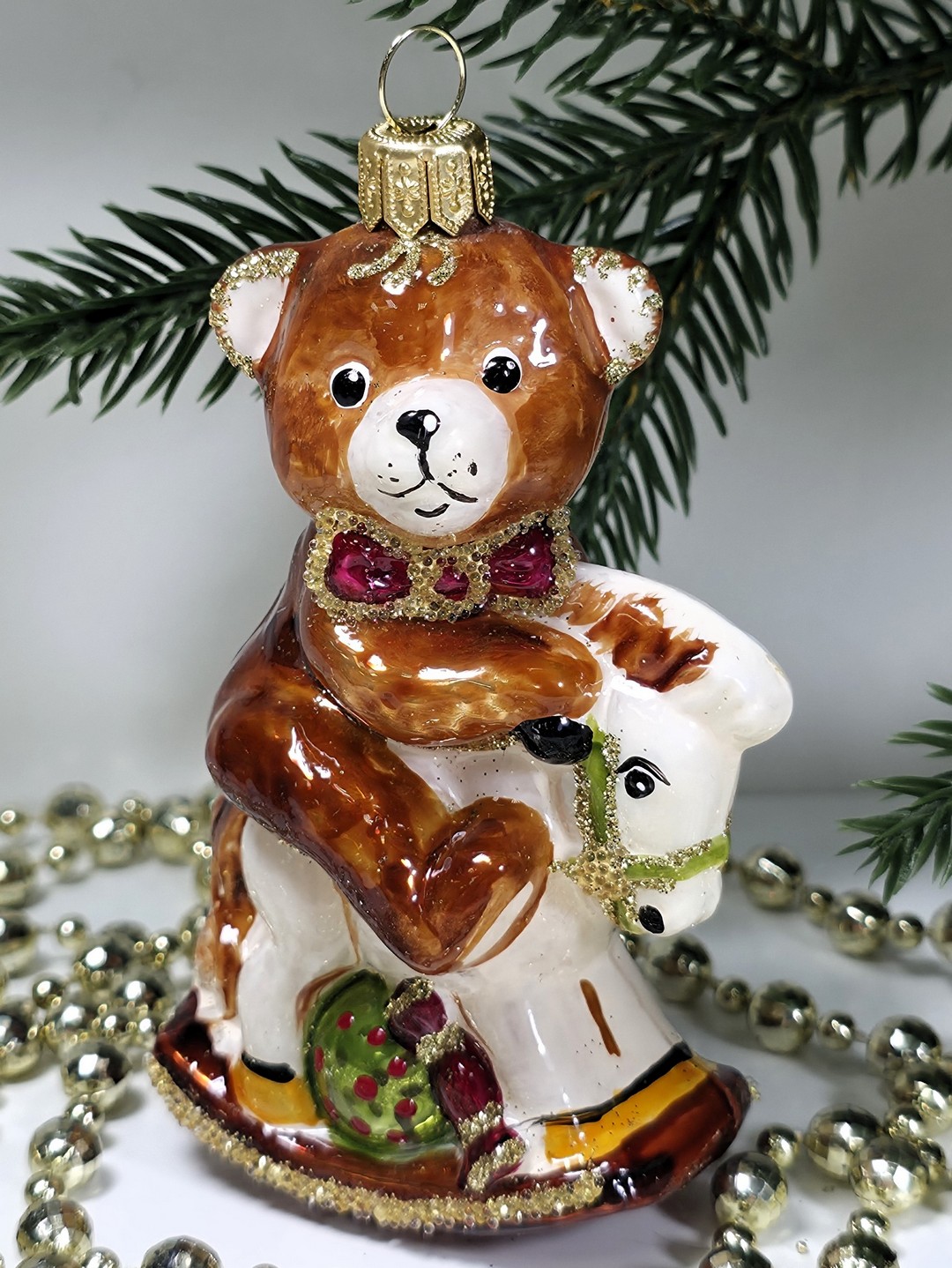 фото Стеклянная елочная игрушка Мишка на лошадке качалке